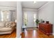 Open foyer featuring hardwood floors, and a cozy seating area at 10802 Tradition View Dr, Charlotte, NC 28269