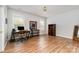 Spacious office featuring a large desk, ample natural light, and hardwood floors at 10802 Tradition View Dr, Charlotte, NC 28269