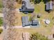 Overhead shot shows home's roof, driveway, and fenced backyard with mature trees and surrounding neighborhood at 11018 Despa Dr, Mint Hill, NC 28227