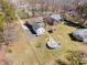 Wide aerial view highlights the property with an in-ground pool, outbuilding, and proximity to surrounding homes at 11018 Despa Dr, Mint Hill, NC 28227