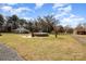 Spacious backyard featuring an above-ground pool, patio furniture, and a large grassy area for outdoor activities at 11018 Despa Dr, Mint Hill, NC 28227