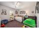 Cozy bedroom with a daybed, ceiling fan, and lots of natural light from the window at 11018 Despa Dr, Mint Hill, NC 28227