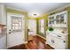 Light filled dining area featuring an antique hutch, natural light, and hardwood flooring at 11018 Despa Dr, Mint Hill, NC 28227