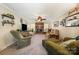 Inviting living room with brick fireplace, neutral tones, comfortable seating, and a ceiling fan for added comfort at 11018 Despa Dr, Mint Hill, NC 28227