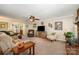 Spacious living room featuring comfortable seating, a large TV, and decorative accents for a cozy and inviting atmosphere at 11018 Despa Dr, Mint Hill, NC 28227