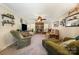 Inviting living room with brick fireplace, neutral tones, comfortable seating, and a ceiling fan for added comfort at 11018 Despa Dr, Mint Hill, NC 28227