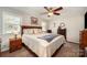 Comfortable main bedroom featuring a ceiling fan, large bed, and natural light at 11018 Despa Dr, Mint Hill, NC 28227