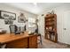 Well-lit office featuring a large wooden desk and built-in bookcase with decor at 11018 Despa Dr, Mint Hill, NC 28227