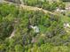 Aerial view of the home shows a secluded retreat surrounded by lush greenery, enhancing privacy and tranquility at 123 Lucy Ln, Statesville, NC 28625