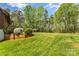 Expansive, lush backyard with mature trees and tasteful landscaping offering a private outdoor space at 123 Lucy Ln, Statesville, NC 28625