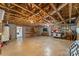 Unfinished basement with exposed beams, plumbed, and shelving for flexible usage at 123 Lucy Ln, Statesville, NC 28625