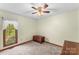 Bright bedroom featuring a ceiling fan and a trunk, offering a peaceful retreat at 123 Lucy Ln, Statesville, NC 28625