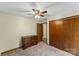 Cozy bedroom features a ceiling fan, closet, dresser, and plush carpeting at 123 Lucy Ln, Statesville, NC 28625