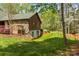 Charming home with a stone foundation, siding, and lush landscaping at 123 Lucy Ln, Statesville, NC 28625