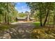 View of the home from the driveway, nestled among the trees at 123 Lucy Ln, Statesville, NC 28625