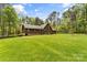 Charming home with a well-manicured lawn, mature trees and a spacious backyard perfect for outdoor activities at 123 Lucy Ln, Statesville, NC 28625