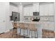 Bright kitchen with island, granite countertops, stainless steel appliances, and seating for three at 1279 31St St, Conover, NC 28613