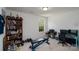 Bright bedroom featuring neutral walls and carpet with a window overlooking a bright, tree-filled lawn at 12915 Settlers Trail Ct, Charlotte, NC 28278