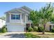 Charming two-story home with a manicured lawn, attached garage, and inviting front entrance at 12915 Settlers Trail Ct, Charlotte, NC 28278