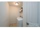 Practical laundry room with a stacked washer and dryer and plenty of storage space at 12915 Settlers Trail Ct, Charlotte, NC 28278