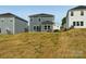 Shot of the home's backyard and exterior with an attached sunroom, with a small amount of grass at 1305 31St Ne St, Conover, NC 28613