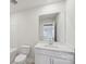 Bathroom featuring a modern vanity, toilet, and mirror over sink at 1305 31St Ne St, Conover, NC 28613