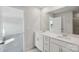 Double vanity bathroom with mirror, tile floors, white trim, and granite countertop at 1305 31St Ne St, Conover, NC 28613