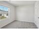 Bright bedroom featuring neutral walls, plush carpeting, and a window offering natural light at 1305 31St Ne St, Conover, NC 28613