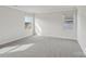 Bright bedroom with plush carpet, light gray walls, and sunlit windows at 1305 31St Ne St, Conover, NC 28613