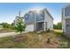 Home with blue siding, brick accents, a two-car garage, and a well-manicured front yard at 1305 31St Ne St, Conover, NC 28613