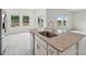 Modern kitchen island boasts granite counters, stainless sink, and scenic backyard views at 1305 31St Ne St, Conover, NC 28613