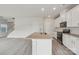 Open concept kitchen with island, stainless appliances, and durable hard surface flooring at 1305 31St Ne St, Conover, NC 28613