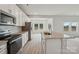 Bright kitchen features an island with a granite countertop and stainless steel appliances at 1305 31St Ne St, Conover, NC 28613