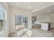 Living space featuring luxury vinyl flooring, access to the backyard, and a view of the kitchen and staircase at 1305 31St Ne St, Conover, NC 28613