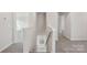 Hallway view of carpeted stairs with gray walls and white trim at 1305 31St Ne St, Conover, NC 28613