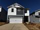 Charming two-story home featuring a two-car garage, modern color scheme and inviting front entrance at 1329 31St Ne St, Conover, NC 28613