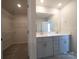 Bathroom featuring a double sink vanity and walk-in closet with shelving units at 1361 31St Ne St, Conover, NC 28613