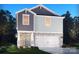 Charming two-story home with stone accents, attached two-car garage, and manicured lawn at 1361 31St Ne St, Conover, NC 28613