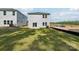 Newly constructed home with a well-maintained backyard, patio, and lush green lawn ideal for outdoor activities at 1466 31St Ne St, Conover, NC 28613