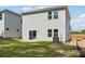 Newly constructed home featuring a grassy backyard with a patio for outdoor relaxation and entertainment at 1466 31St Ne St, Conover, NC 28613
