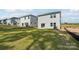 Grassy backyard with newly constructed home and patio, perfect for relaxing or entertaining guests outdoors at 1466 31St Ne St, Conover, NC 28613