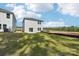 Home with lush backyard, concrete patio, and professional landscaping, perfect for entertaining and relaxation at 1466 31St Ne St, Conover, NC 28613