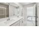 Bright bathroom featuring double sinks, sleek countertops, and a glass-enclosed shower with convenient access at 1466 31St Ne St, Conover, NC 28613