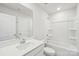 Bright, neutral bathroom with a double sink vanity, shower-tub, and tiled flooring at 1466 31St Ne St, Conover, NC 28613