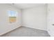 Bright, airy bedroom with a large window overlooking a natural landscape and plush carpeting at 1466 31St Ne St, Conover, NC 28613