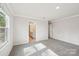 Bright bedroom with plush carpeting, light-colored walls, and an ensuite bathroom for added convenience at 1466 31St Ne St, Conover, NC 28613