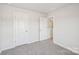 Neutral bedroom featuring plush carpeting, two doors, and ample natural light at 1466 31St Ne St, Conover, NC 28613