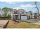 Charming two-story home featuring a two-car garage, brick accents, and blue shutters at 1466 31St Ne St, Conover, NC 28613