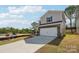 Charming two-story home featuring a two-car garage, brick accents, and blue shutters at 1466 31St Ne St, Conover, NC 28613