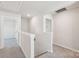Upstairs hallway with neutral walls and plush carpeting provides access to the bedrooms at 1466 31St Ne St, Conover, NC 28613